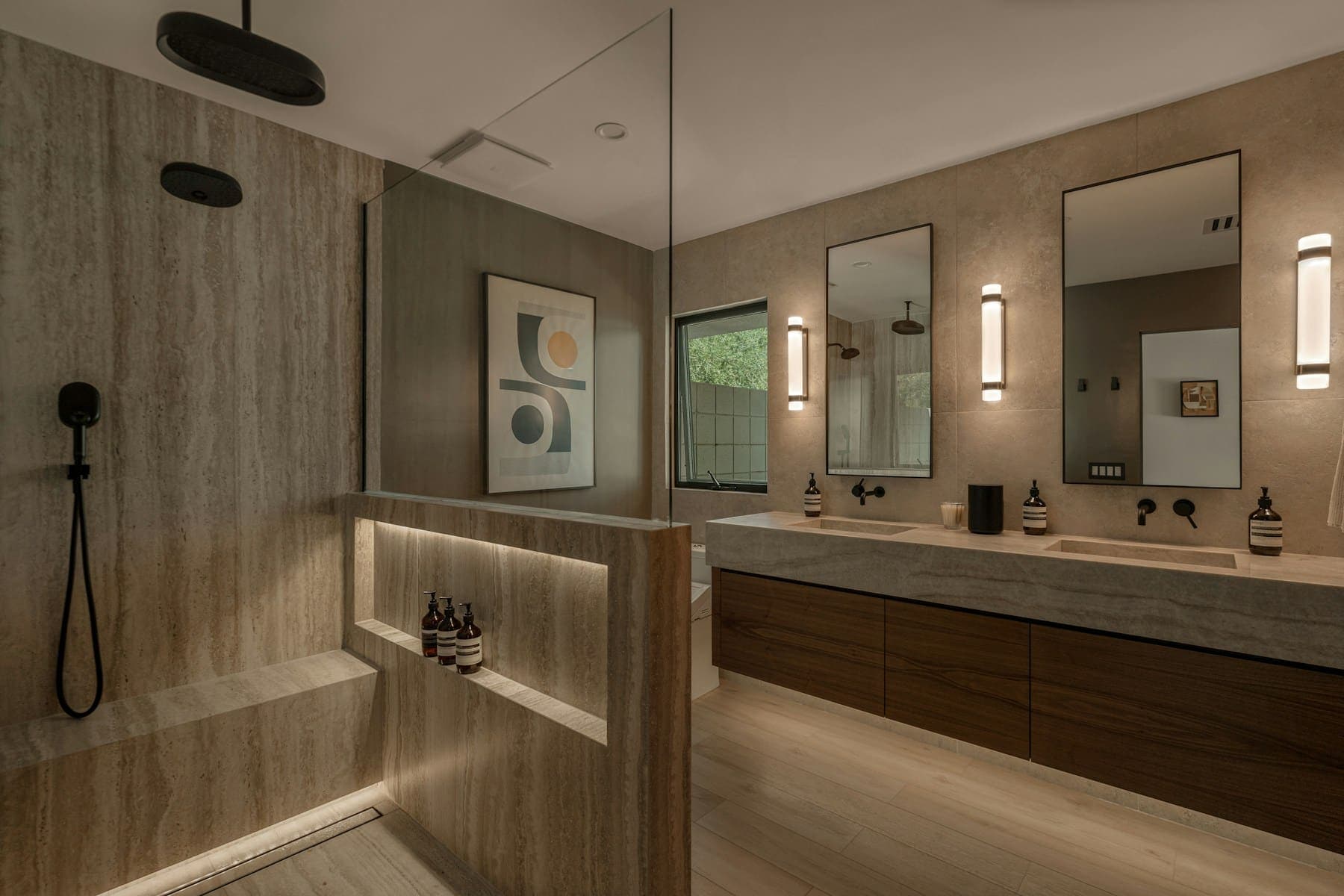 Double vanity with timber drawers beside a glazed walk-in shower