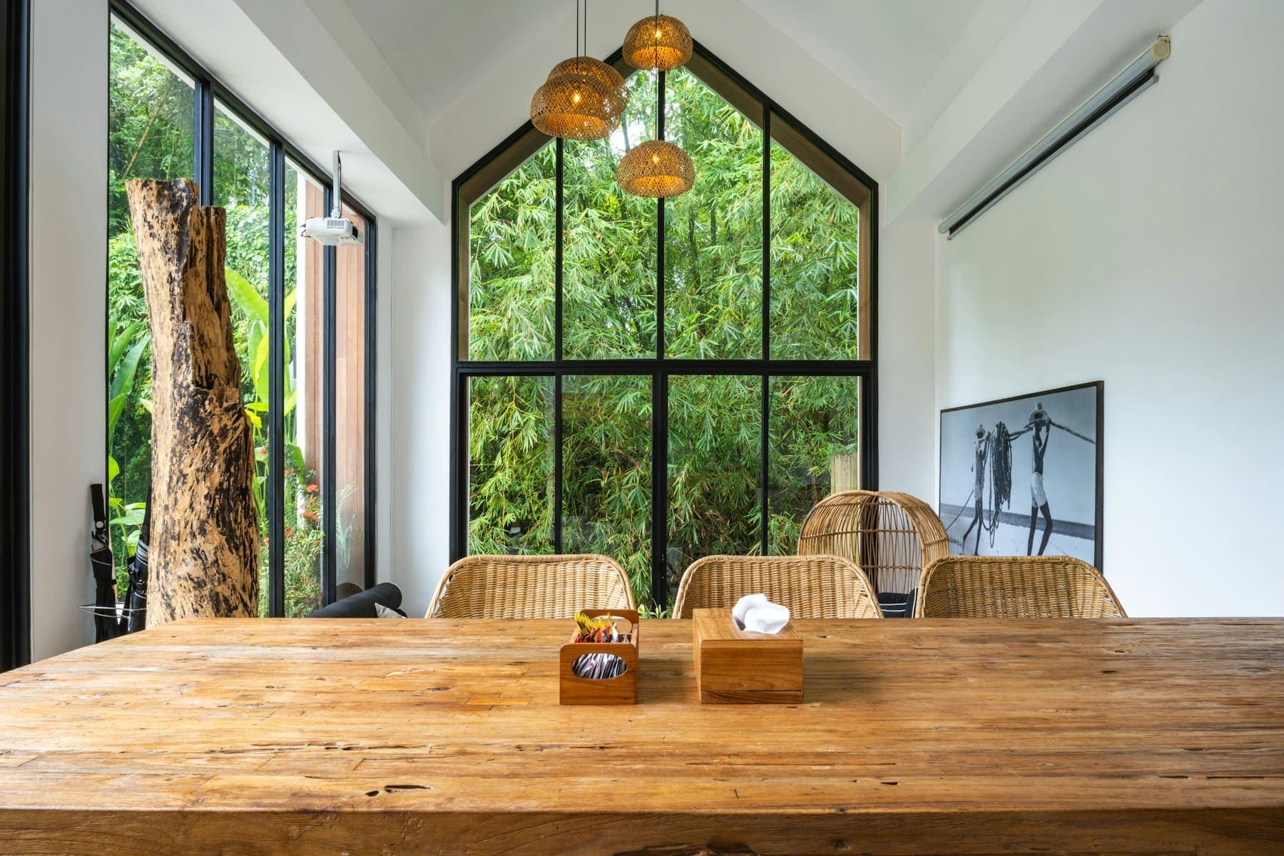 Bright interior with a gable window looking out to trees