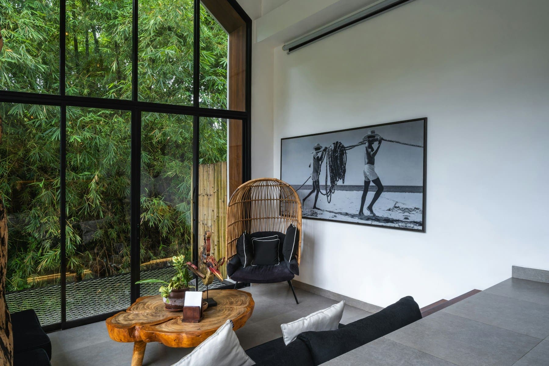 Interior with full-height glazing overlooking greenery